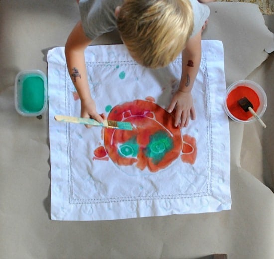 Glue batik project- using washable gel glue and paint on napkins to make school lunch reusable napkins- how eco-friendly! Artchoo.com