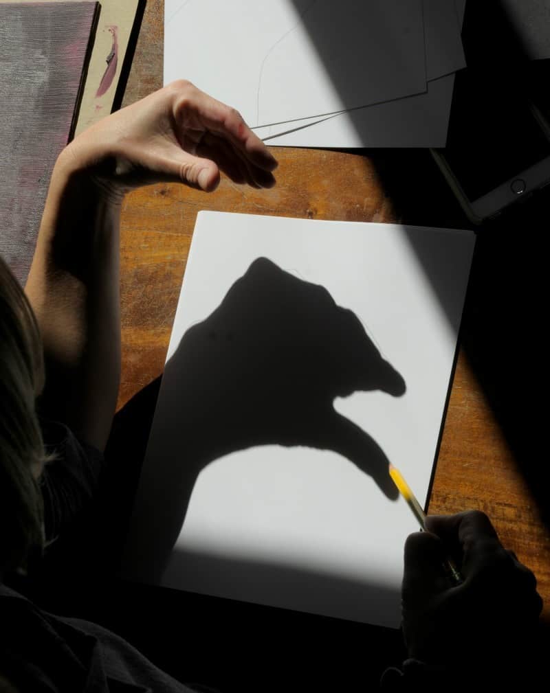 Tracing hand shadows for monster drawings