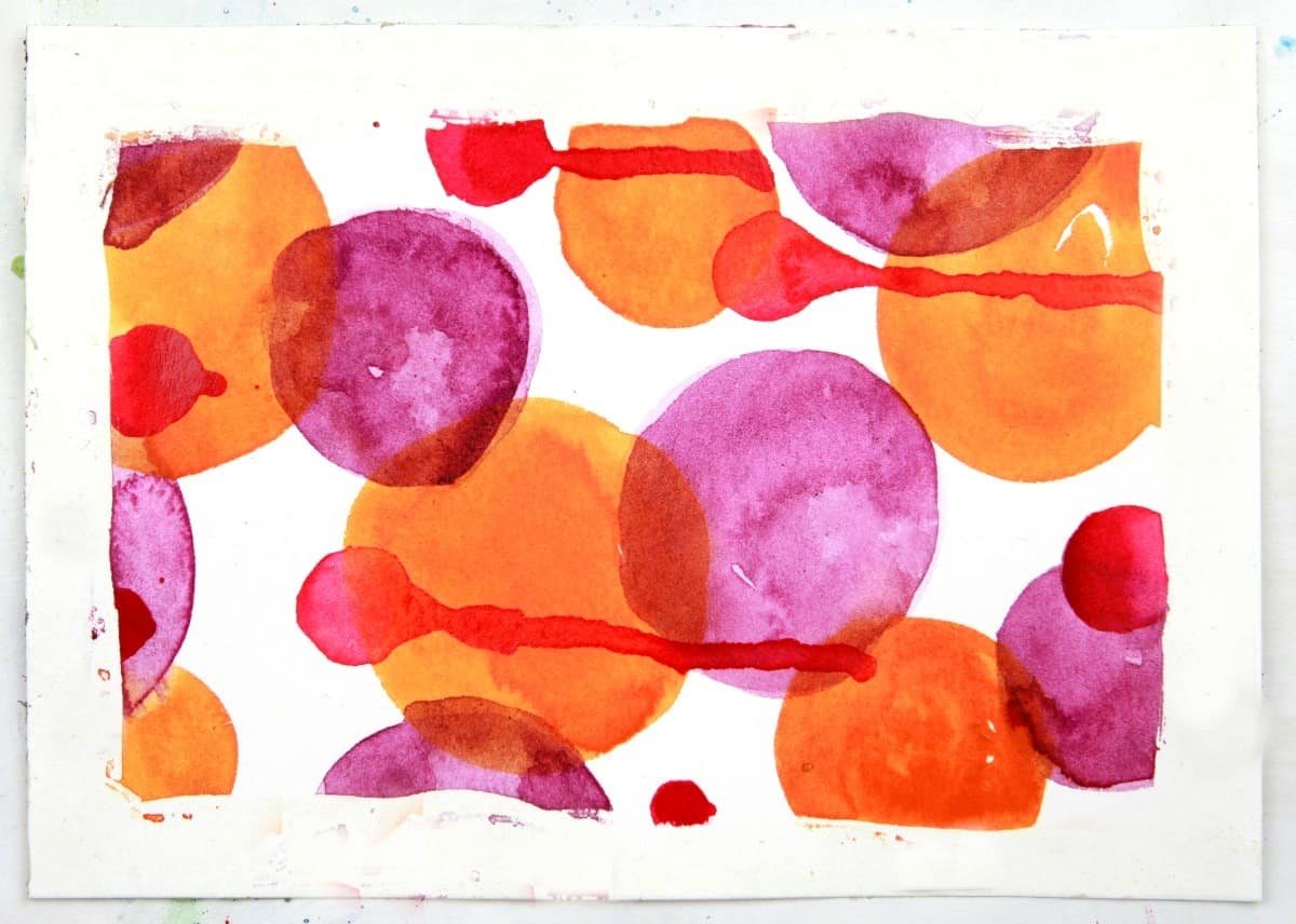 watercolor circles with rubber cement resist technique