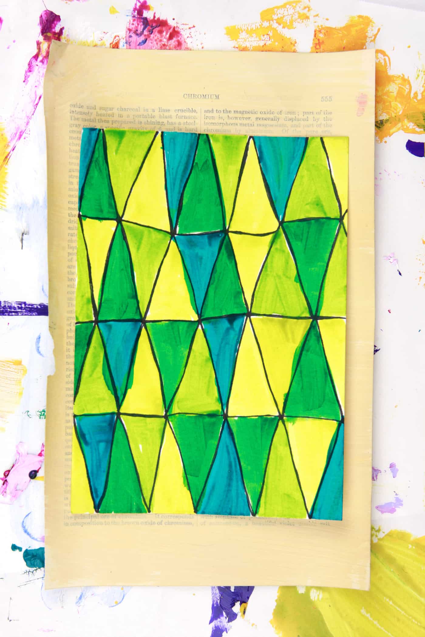 washes of acrylic paint in drawn triangle pattern on paper