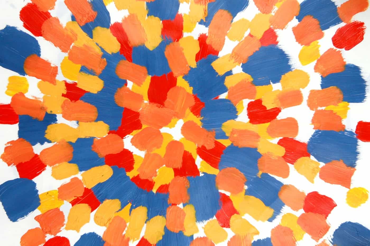 orange, blue, and yellow acrylic paint daubs on paper radiating out from center