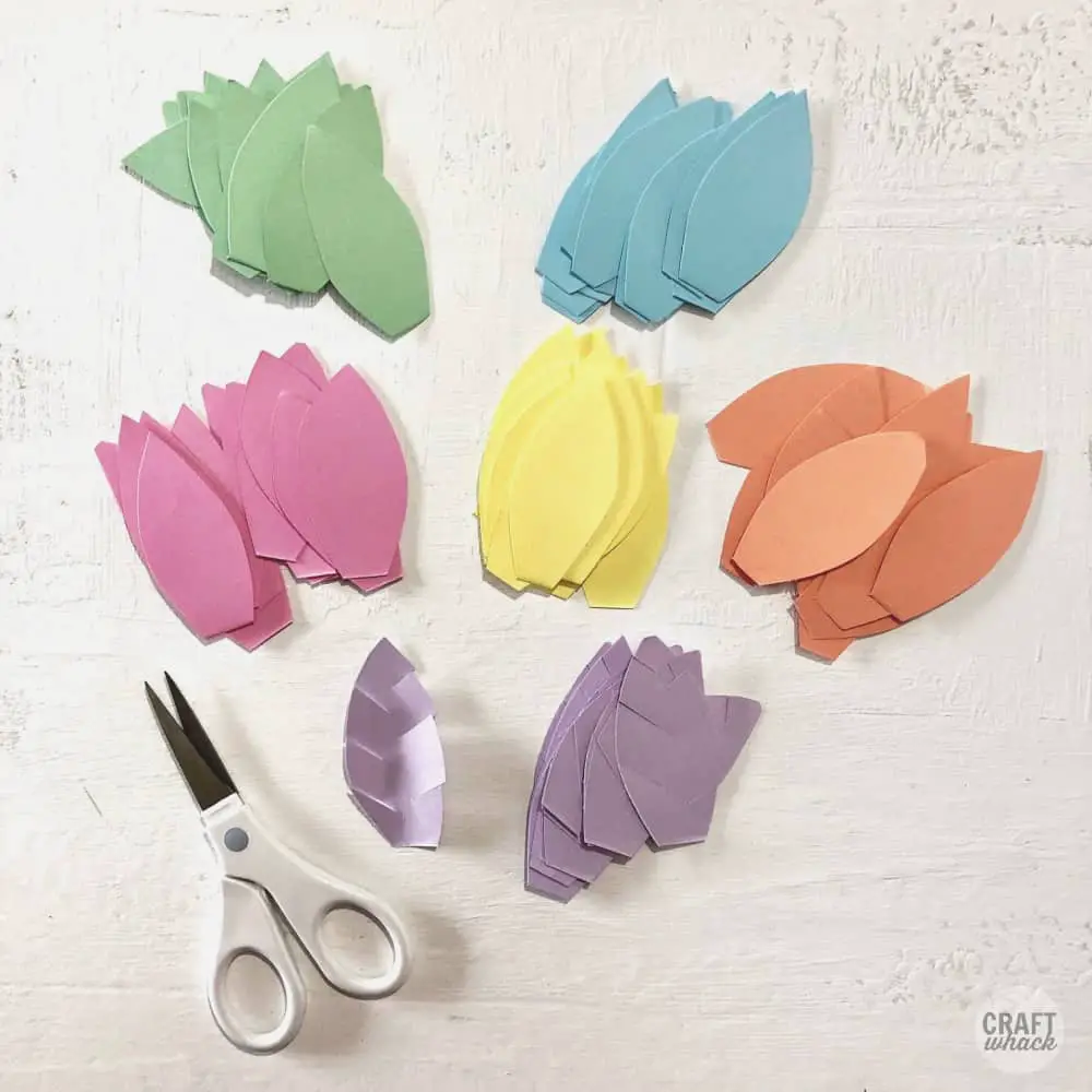piles of paper leaves cut out from cardstock