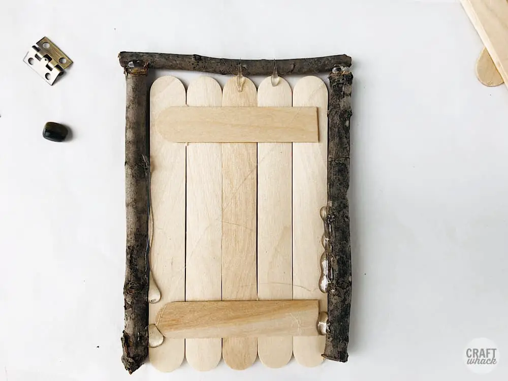 fairy door construction with sticks