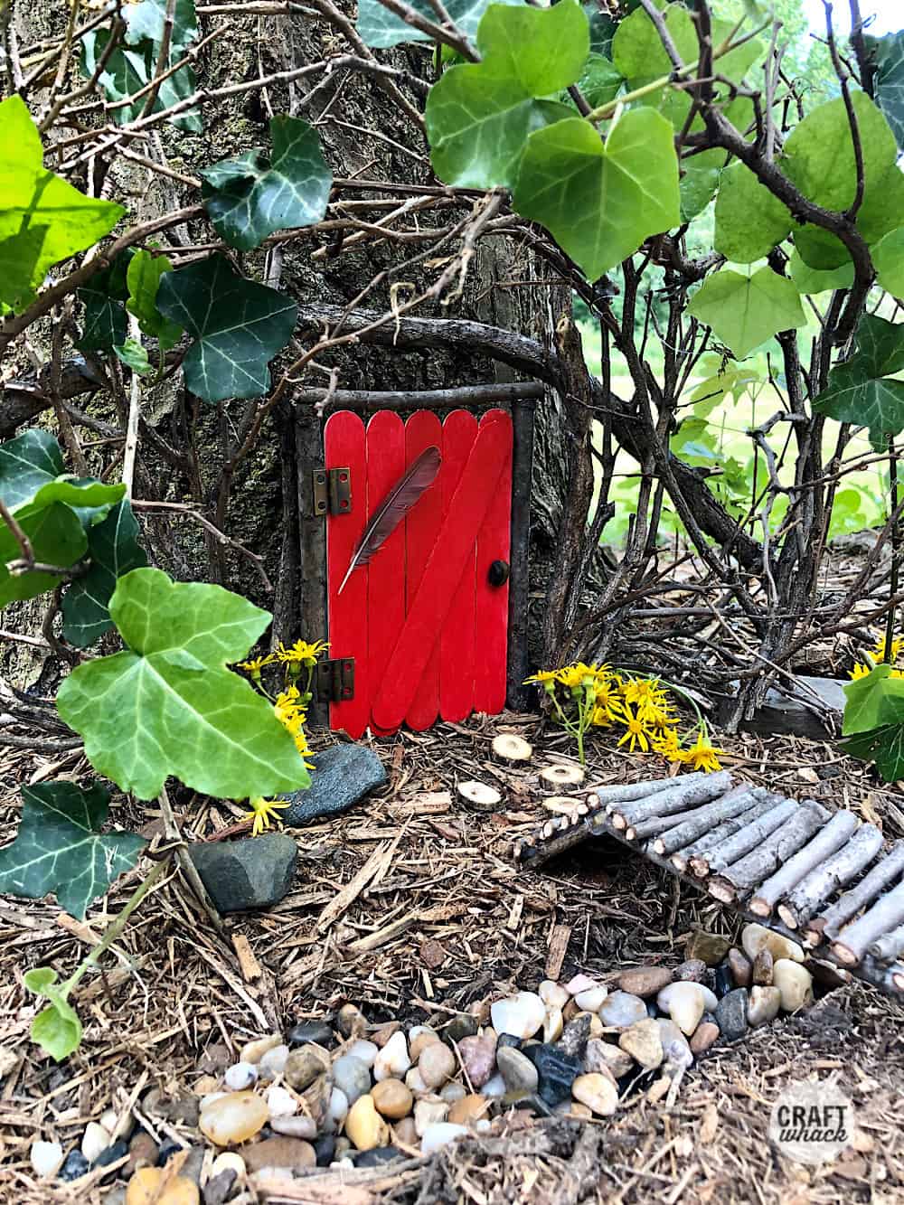 popsicle stick fairy door in tree