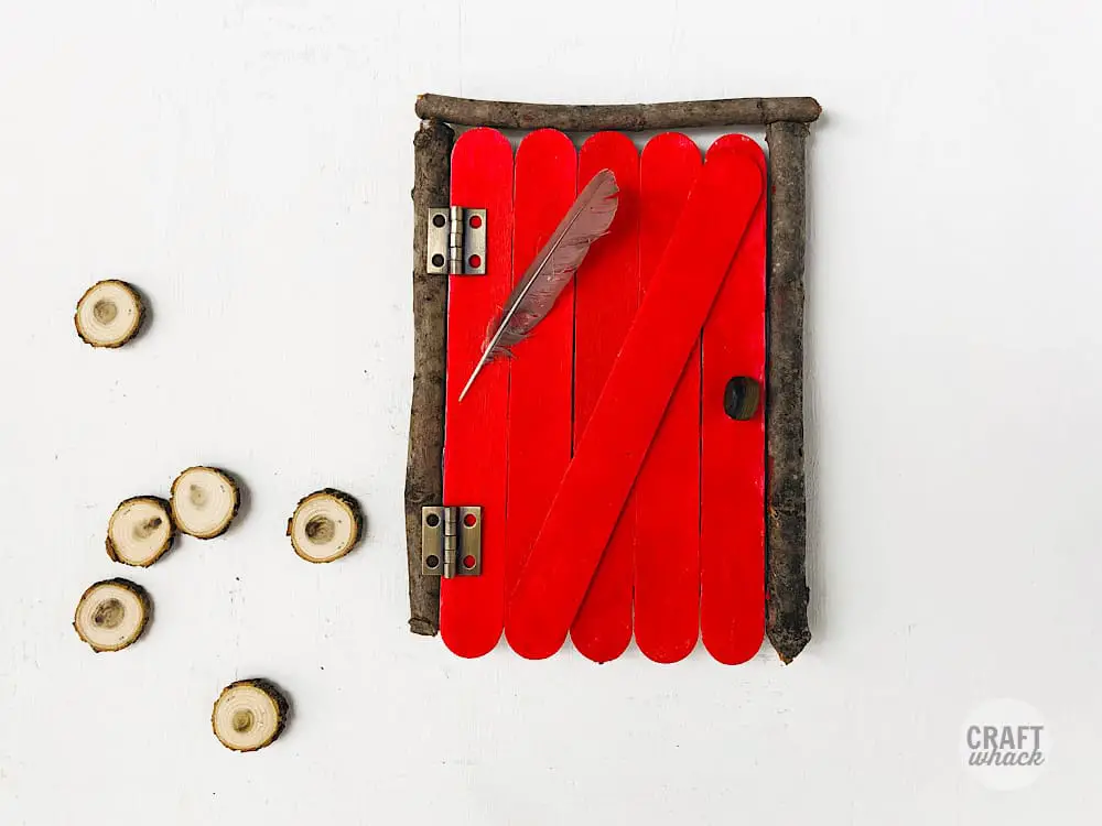 red painted popsicle stick fairy door 