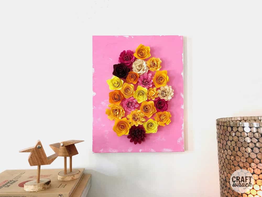 quilled paper flower art hanging on wall