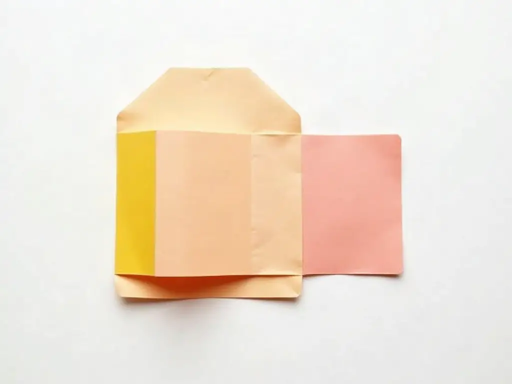 Colored paper folded and cut with parallel slits to make a lantern